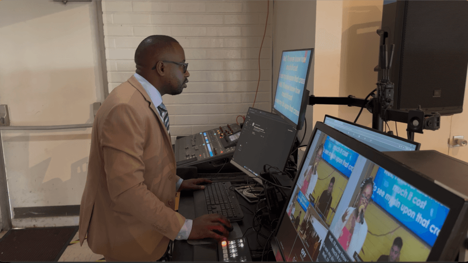CAGI media team operating the video production setup during a worship service